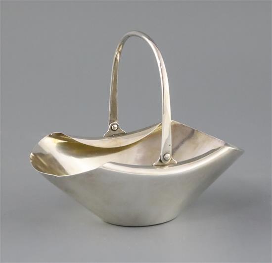 A late Victorian silver Hukin and Heath sugar basket, designed by Christopher Dresser,